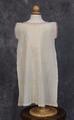 Child's dress of ivory hand-spun, hand-woven cotton and silk crepe yarns