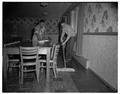 Cleaning the dining room of the new men's residence co-op, September 1954