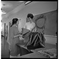 Students examining chair textiles, February 1964