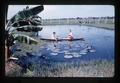 "Alice Anne and Merrie in boat in pond," 1976