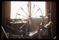Spinning wheel with finials