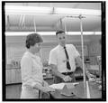 Jean Saubert, OSU student and Olympic skiing medalist, with a faculty member in the laboratory, July 1964