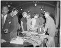 Foreign students looking over exhibits at Cosmopolitan Club meeting, September 30, 1950