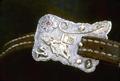 Detail of buckle on headstall showing barrel rider motif