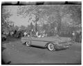 Homecoming queen participating in a parade, November 9, 1957