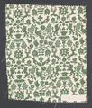 Textile panel of ivory cotton with green pattern of crest-like images of birds, lions, bucks, plants, flowers, and grapes