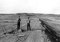 Men working on Virgil Moon Reservoir, Harney County