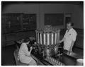 Evaluating a sample in a Withycombe Hall laboratory, April 1952