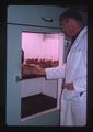 Knud Swenson inspecting growth control chamber, Oregon State University, Corvallis, Oregon, January 1964