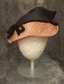 Hat of navy and pale pink ribbed straw with soft crease at side