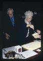 John Fowler and Katherine Fowler getting cake at 90th birthday, Mid Valley Coin Club, Corvallis, Oregon, circa 1973