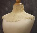 Collar of ivory crocheted lace with high standing band collar