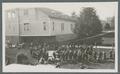 Group of cadets next to old Gymnasium, circa 1920