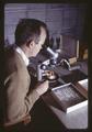 Dr. Peter Westigard using microscope, Southern Oregon Agricultural Experiment Station, 1967