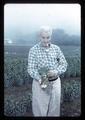 Walter Bornhoff holding Easter lily, Brookings, Oregon, circa 1965