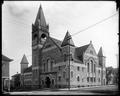 First Baptist Church (White Temple) at corner of Taylor and 2nd, Portland. Stone building with arched entryway. Power pole in foreground.