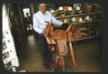 Mr. Everett Gibson with one of his completed saddles, another view