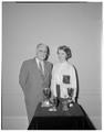 Earl W. Wells and Beverly Burgoyne with her speech contest trophies, 1960