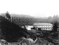 Spruce camp next to railroad trestle, near Newport, Oregon?