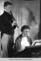 Mary Home, composer, at the keyboard and her son, Caldren, playing recorder