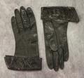 Gloves of black leather with a turned-up cuff of black snakeskin textured leather