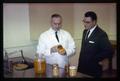 Researchers examining jars of beans, 1963