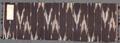 Textile Panel of black cotton with Ikat weave of horizontal stripes with blurred zig-zag motifs