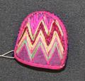 Thimble (Kolmu) of fabric covered over layered paper trimmed along the edge in fuchsia yarns