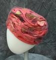 Turban of pink silk faille with dyed flower petals of velvet throughout