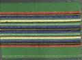Textile Panel (used for skirts) of hand-woven striped cotton in green with plain and patterned stripes