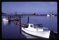 Fishing boats and cargo ships near Astoria-Megler Bridge, Astoria, Oregon, circa 1966