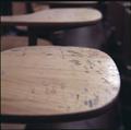 Carvings on a classroom desk