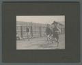 Floyd Williams (right) running in a track meet, circa 1905