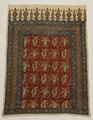 Wall Hanging of natural woven linen with block print of paisley, floral and lamp motifs patterned in blocks and bands on rectangular textile