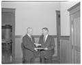 President Jensen presenting a certificate to an unidentified individual