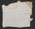 Handkerchief fragment of linen batiste with basted trim of ecru bobbin lace in a floral and leaf design