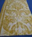 Textile Panel of ecru cotton with large block print of a lively ornate hanging plant design in mottled shades of gold