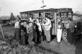 Youth boarding school bus to go to the fields