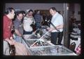Dennis Hanking among others at a coin show, 1989
