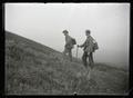 Bohlman and Finley hiking with camera equipment