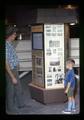 Lake County Extension staffer and Carter Nygaard viewing Robert W. Henderson images exhibit, Lakeview, Oregon, circa 1972