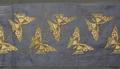 Textile fragment of navy blue taffeta with embroidered butterflies