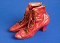 Boots of red leather with 10 scalloped eyelets