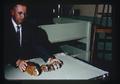 Ralph Bogart with guinea pigs, Oregon State University, Corvallis, Oregon, September 1963