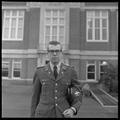Clifford Dempster, a member of the OSU G.E. College Bowl team, posing near Kerr Library