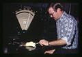 Greg Garmon weighing rat, Oregon State University, Corvallis, Oregon, May 1963