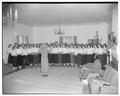 Large choral group at Snell Hall preparing for Christmas songs, December 1949