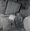 Two Workers Closing Burlap Hop Bale 5