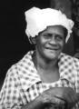 African-American woman in plaid shirt