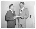 State 4-H Club leader Burton Hutton presenting a 4-H award